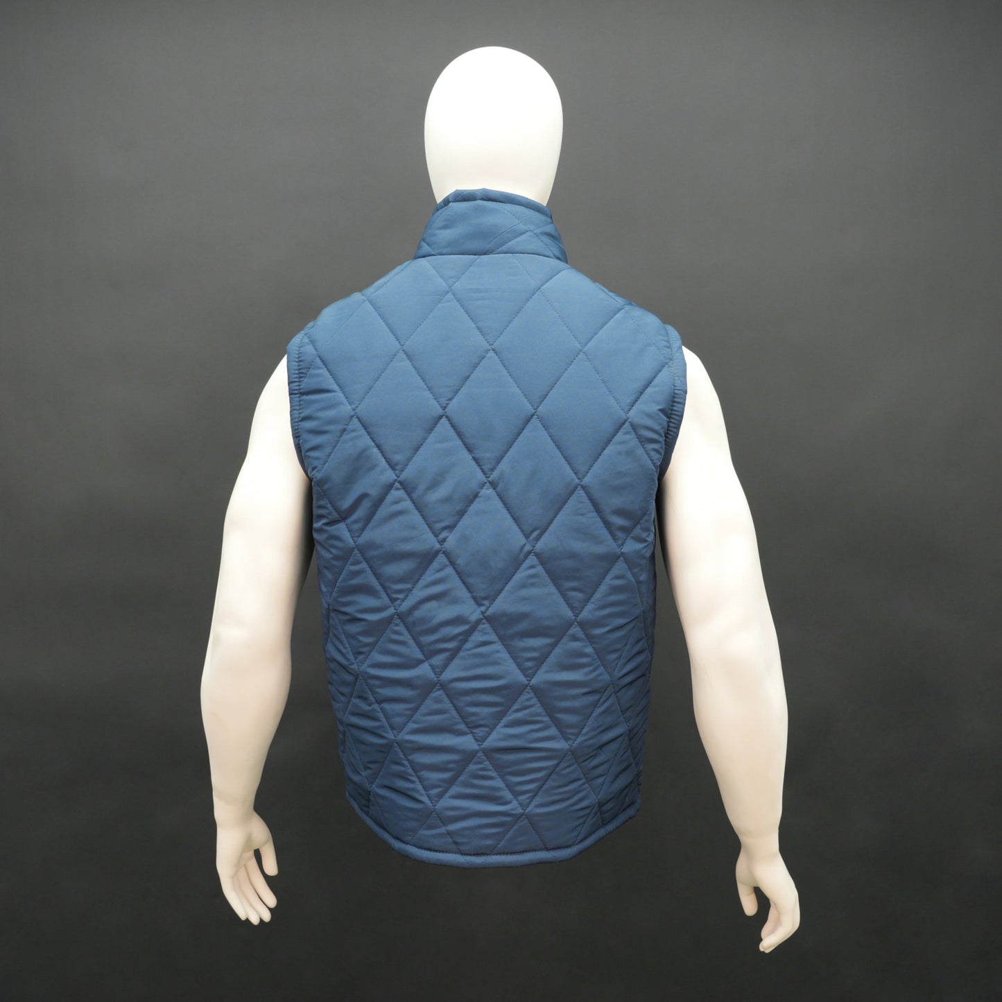Men’s lightweight diamond quilted sleeveless puffer gilet with front zip, three pockets, available in navy, green, and blue