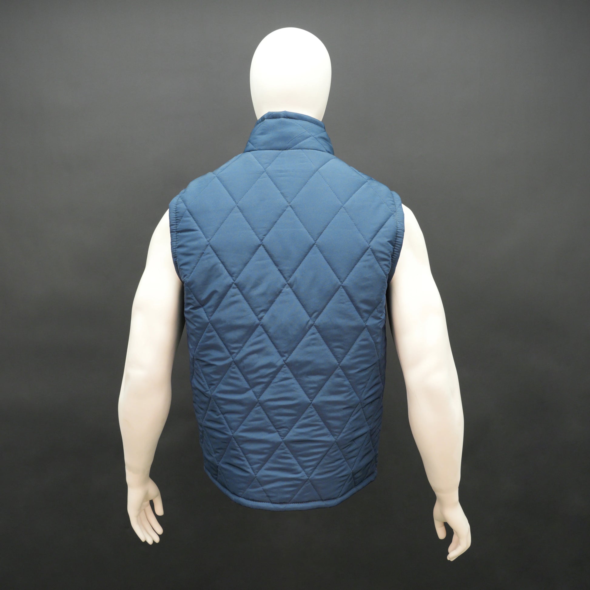Men’s lightweight diamond quilted sleeveless puffer gilet with front zip, three pockets, available in navy, green, and blue