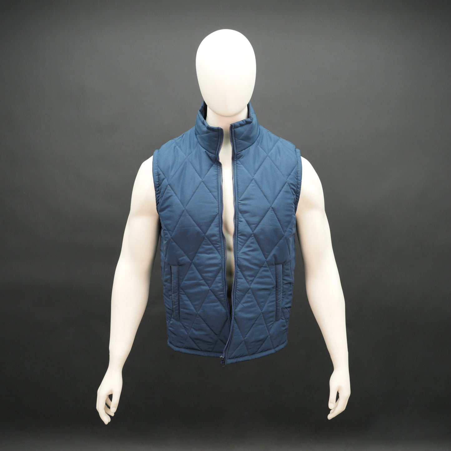 Men’s lightweight diamond quilted sleeveless puffer gilet with front zip, three pockets, available in navy, green, and blue