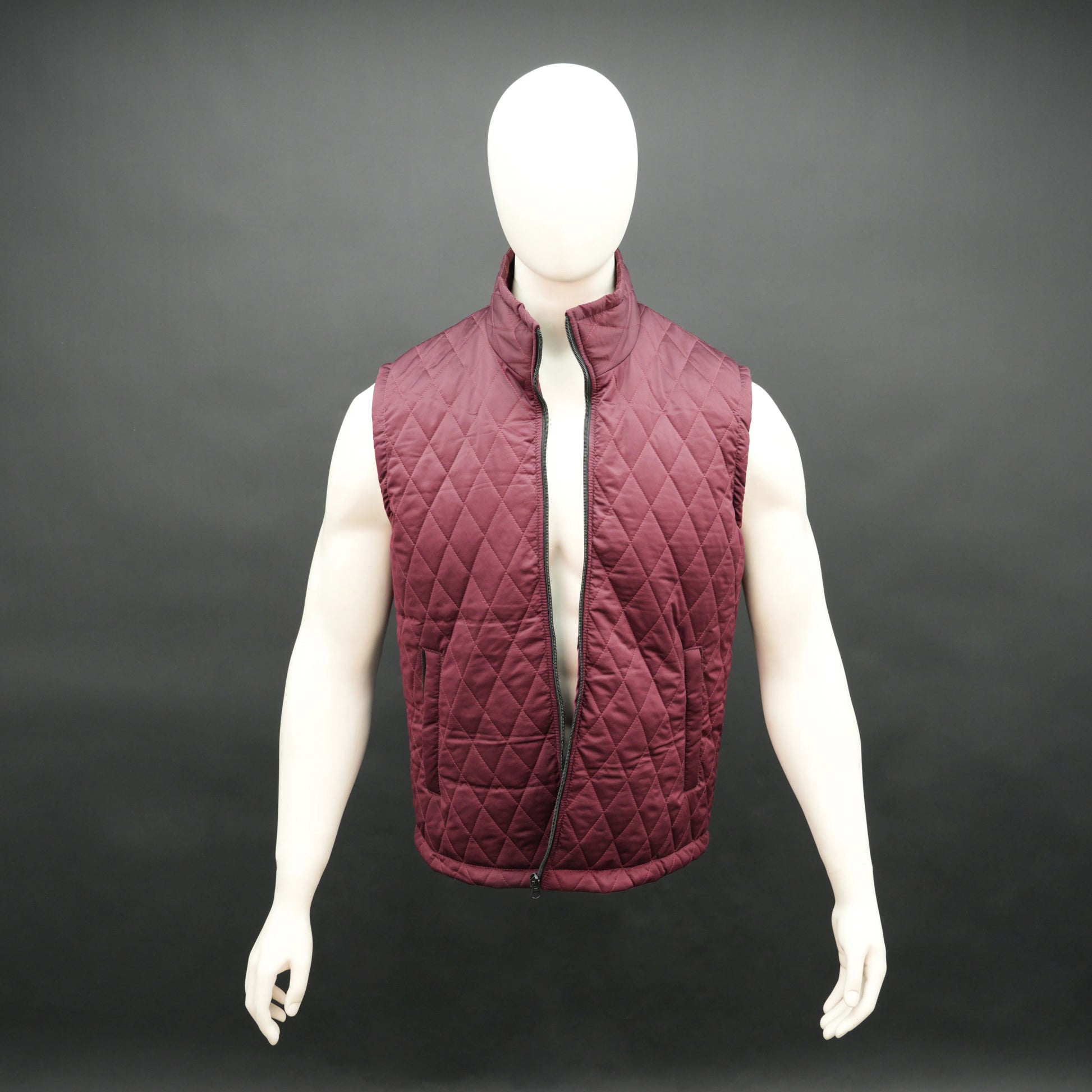 Maroon sleeveless quilted jacket with front zip, lightweight fabric, and multiple pockets