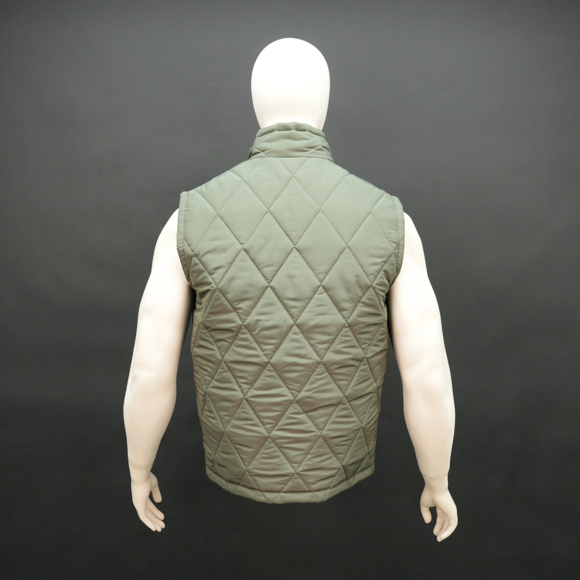 Men’s green lightweight quilted puffer gilet sleeveless zip vest with pockets for layering.
