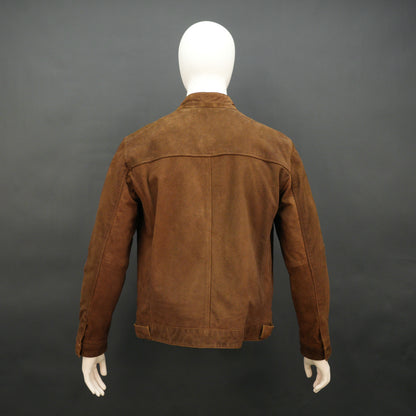 Men’s brown suede leather jacket with button-zip closure, front pocket, and modern fit, combining rugged durability with a refined silhouette
