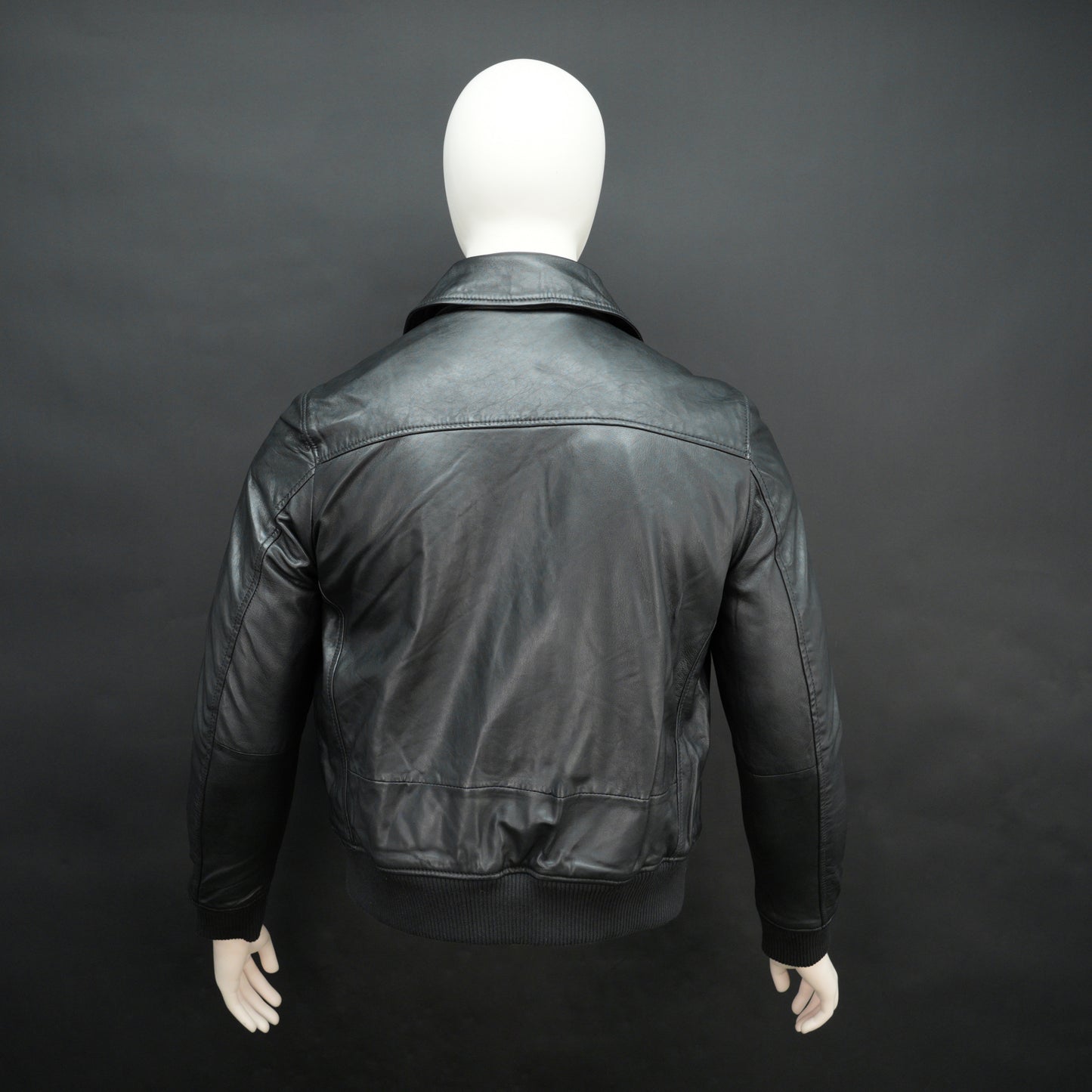 Men’s black leather jacket made from soft sheep leather with front zipper and multiple pockets