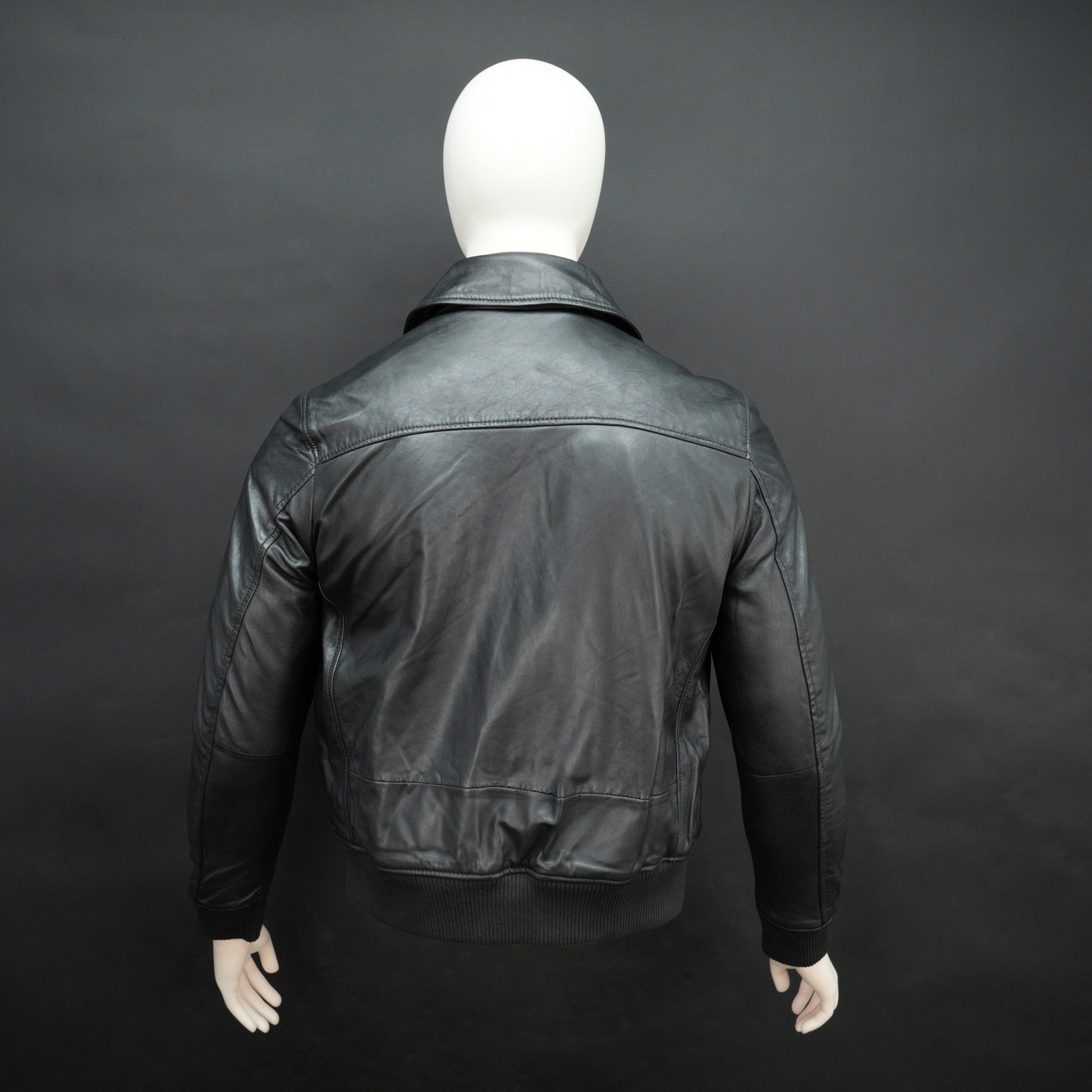 Men’s black leather jacket made from soft sheep leather with front zipper and multiple pockets