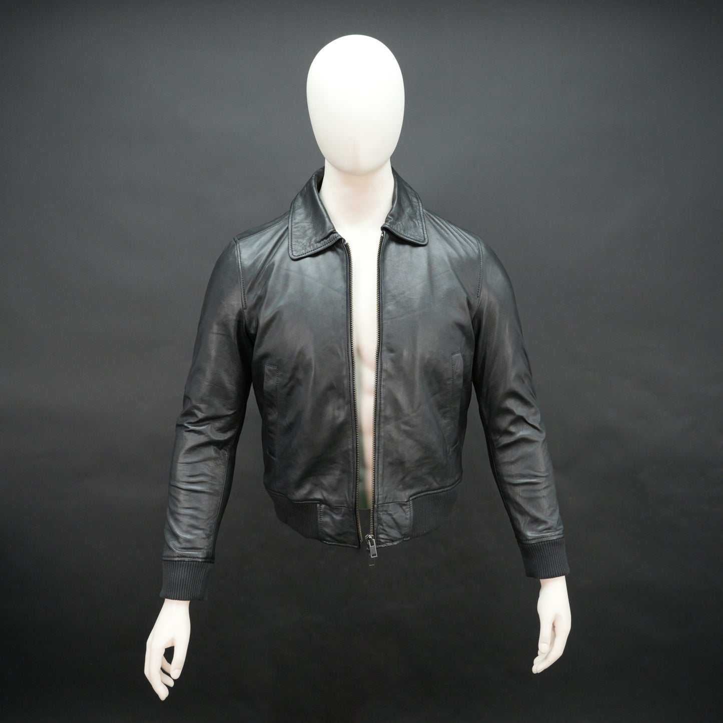 Men’s black leather jacket made from soft sheep leather with front zipper and multiple pockets