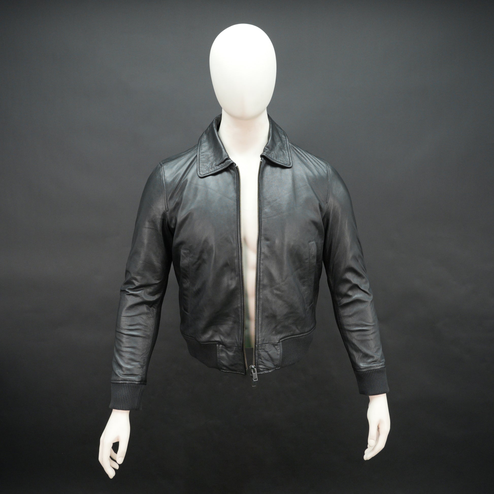 Men’s black leather jacket made from soft sheep leather with front zipper and multiple pockets