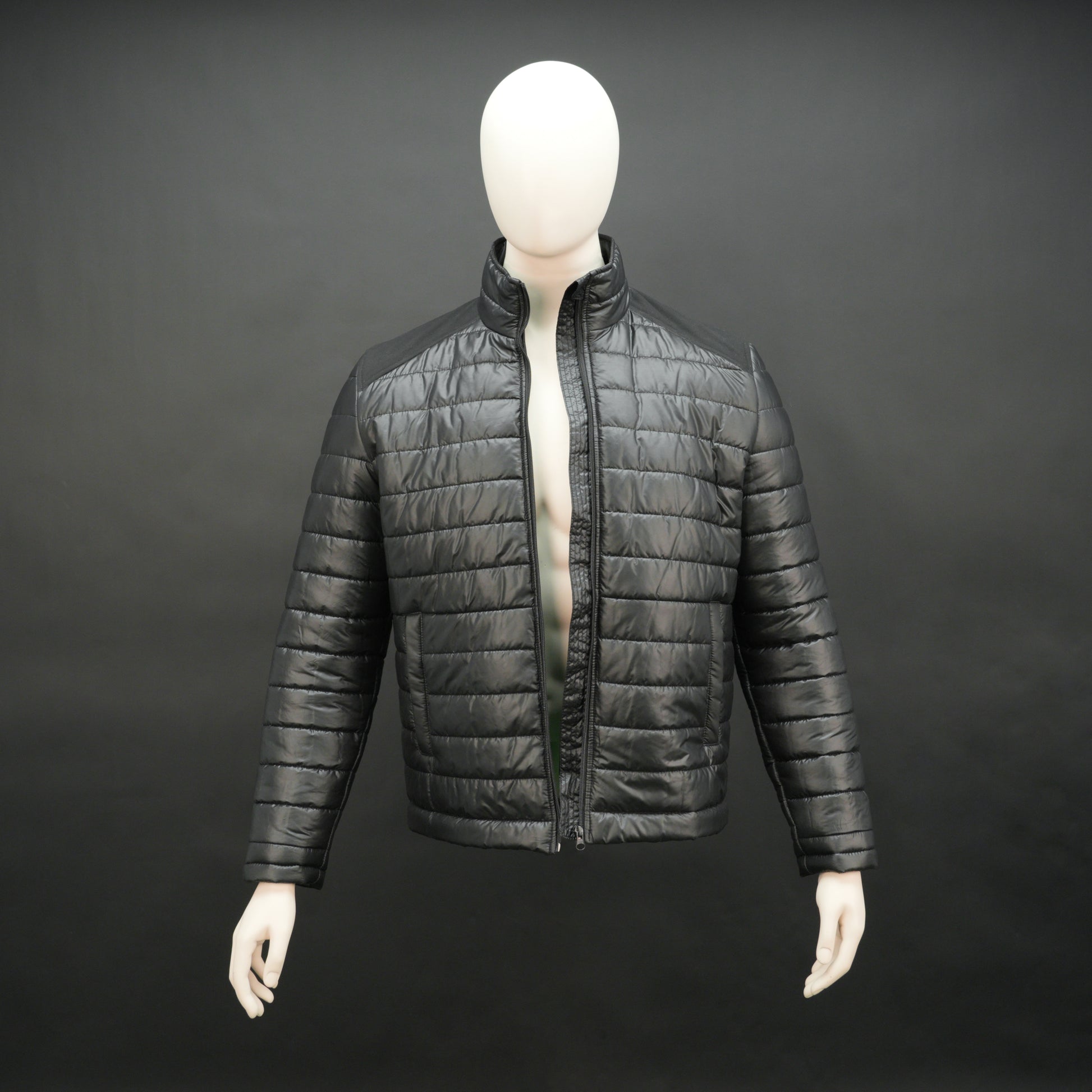 Two-tone caramel and tan quilted puffer jacket with zip closure and warm padding.