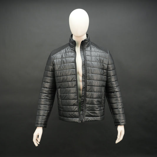 Two-tone caramel and tan quilted puffer jacket with zip closure and warm padding.