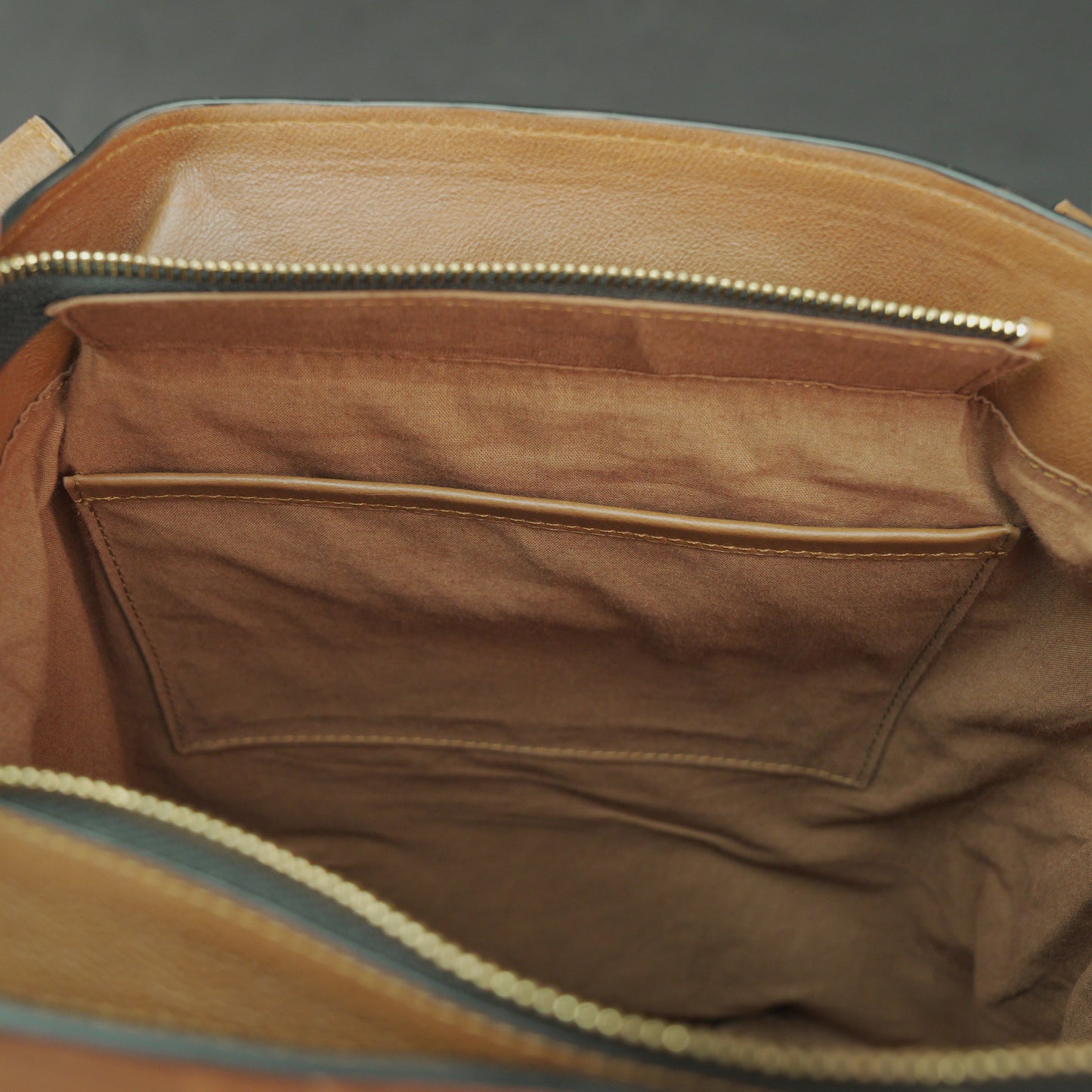 Neverfull Casetto genuine cowhide leather tote bag with spacious interior, strong comfortable handles, and elegant minimalist design—perfect for work, shopping, travel, and everyday use.