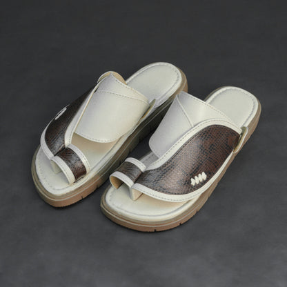 Off-white Arabic chappal with snake-pattern PU upper and EVA sole.