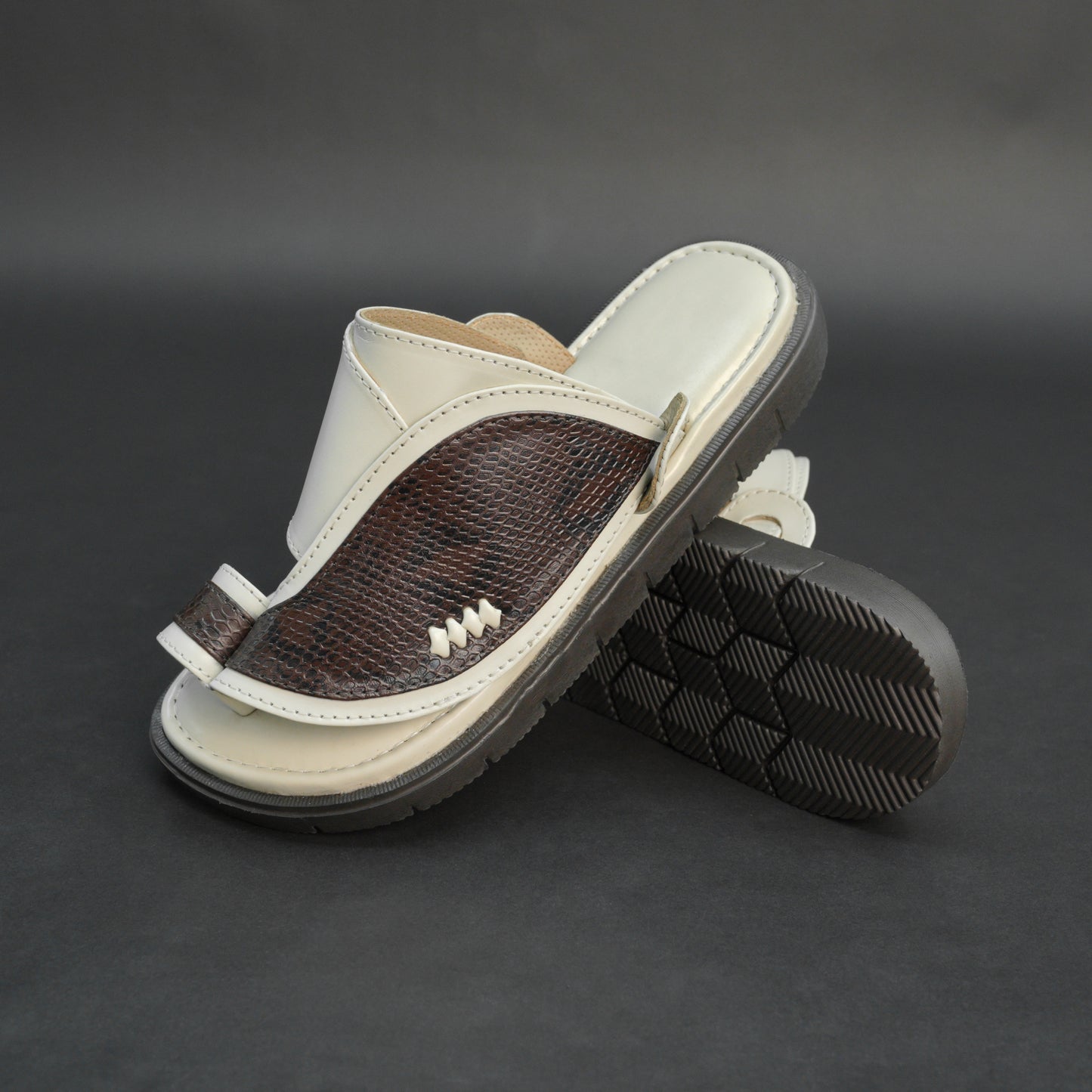 Off-white Arabic chappal with snake-pattern PU upper and EVA sole.