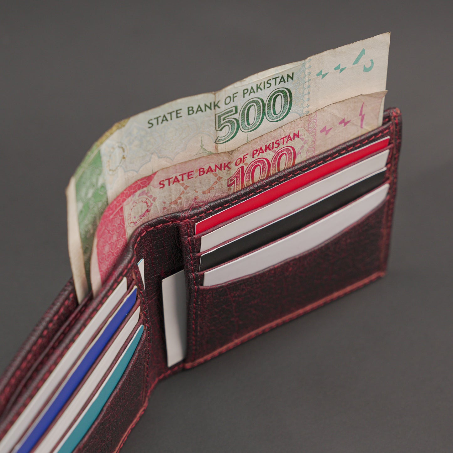 Premium maroon leather wallet, slim, durable, and lightweight holds 10 cards with 2 cash compartments.