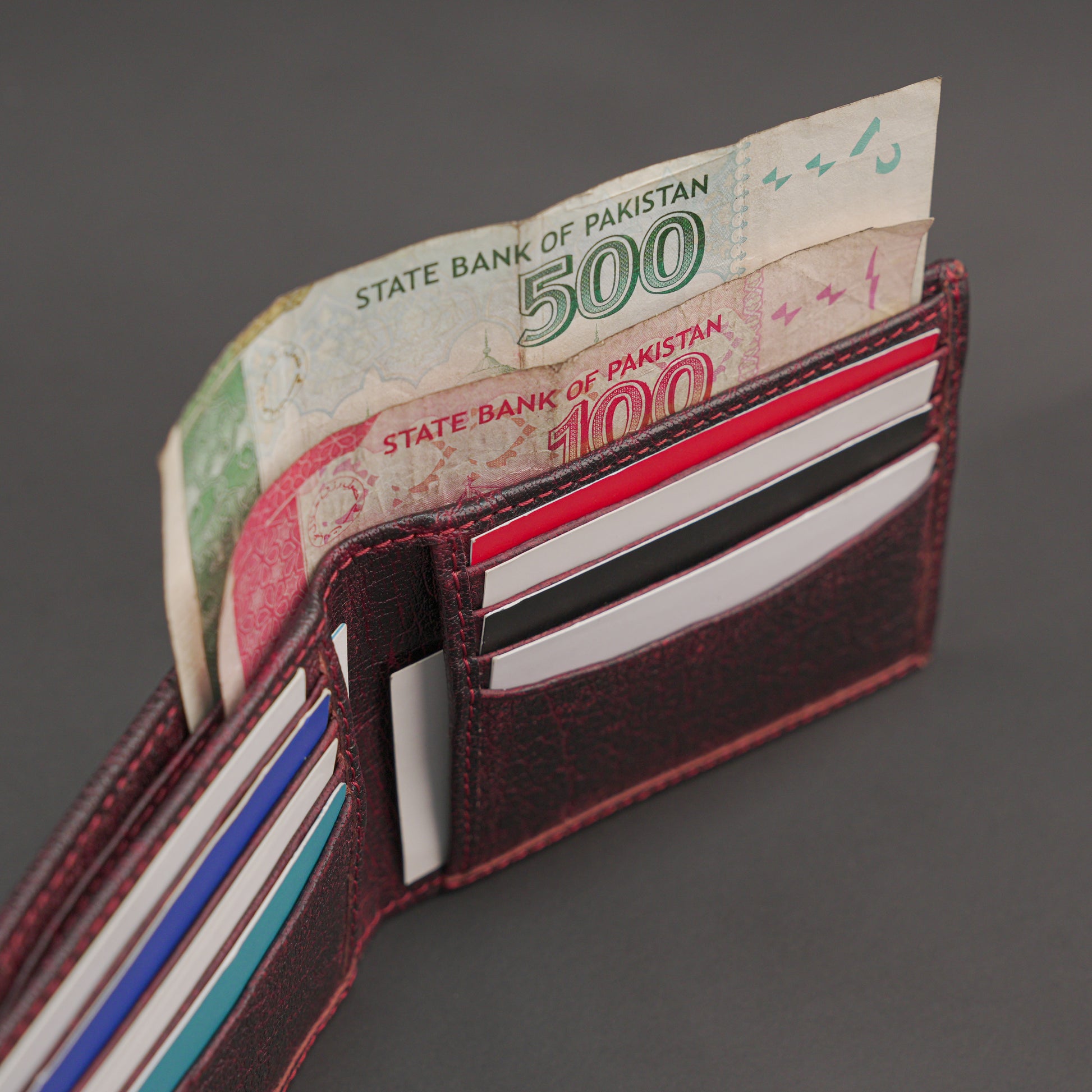 Premium maroon leather wallet, slim, durable, and lightweight holds 10 cards with 2 cash compartments.