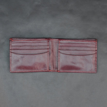 Premium maroon leather wallet, slim and durable, holds 10 cards with 2 cash compartments.