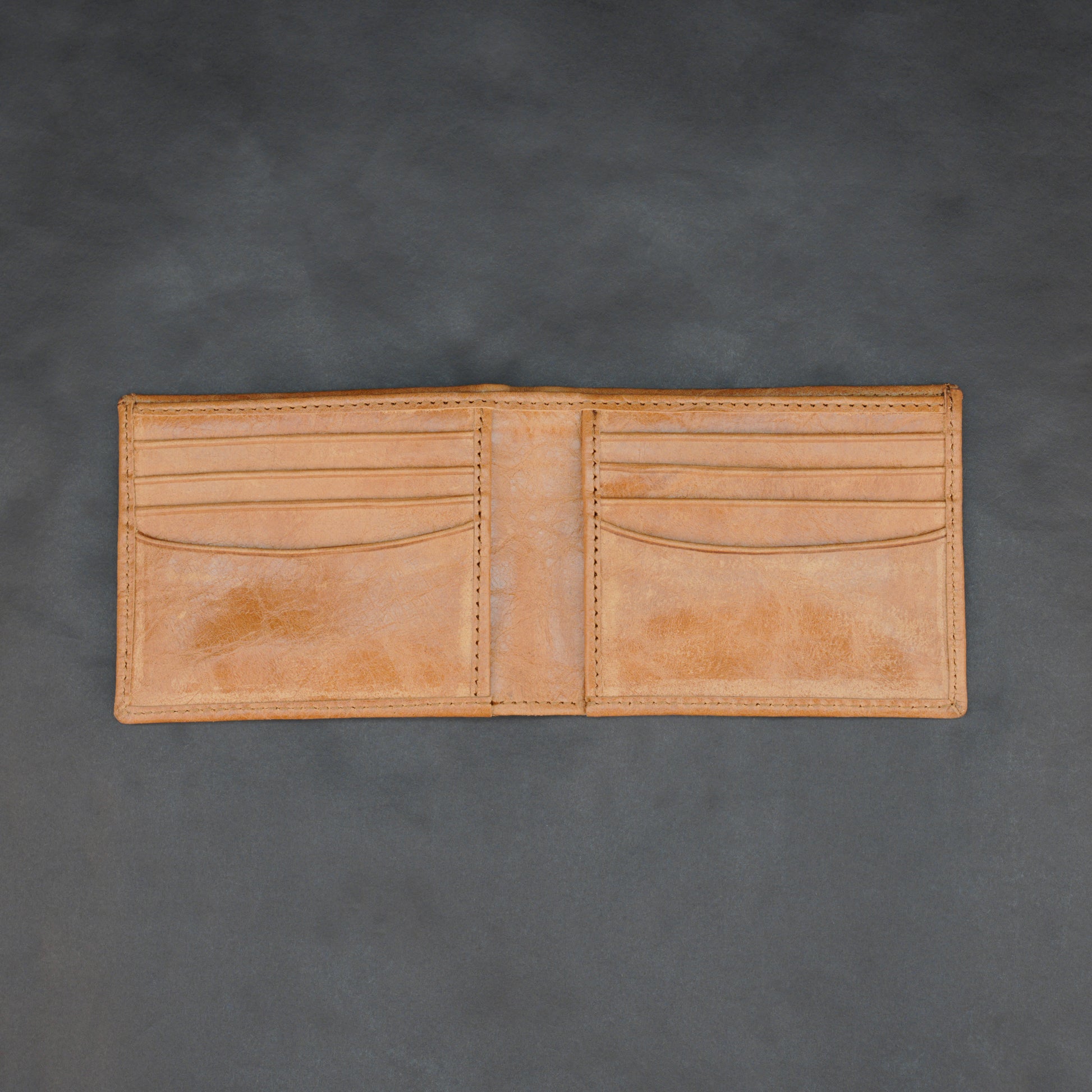 Premium orange leather wallet, slim, lightweight, and durable fits 10 cards with 2 cash compartments.