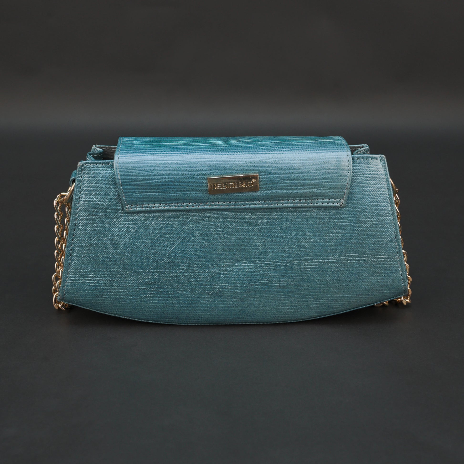 Aqua real leather handbag with brass chain and zipper compartment.