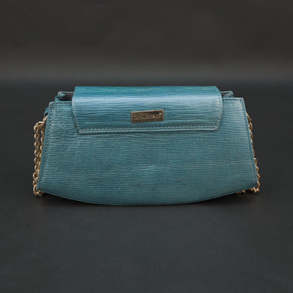 Aqua real leather handbag with brass chain and zipper compartment.