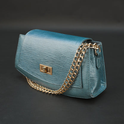 Aqua real leather handbag with brass chain and zipper compartment.