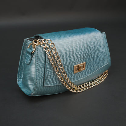 Aqua real leather handbag with brass chain and zipper compartment.
