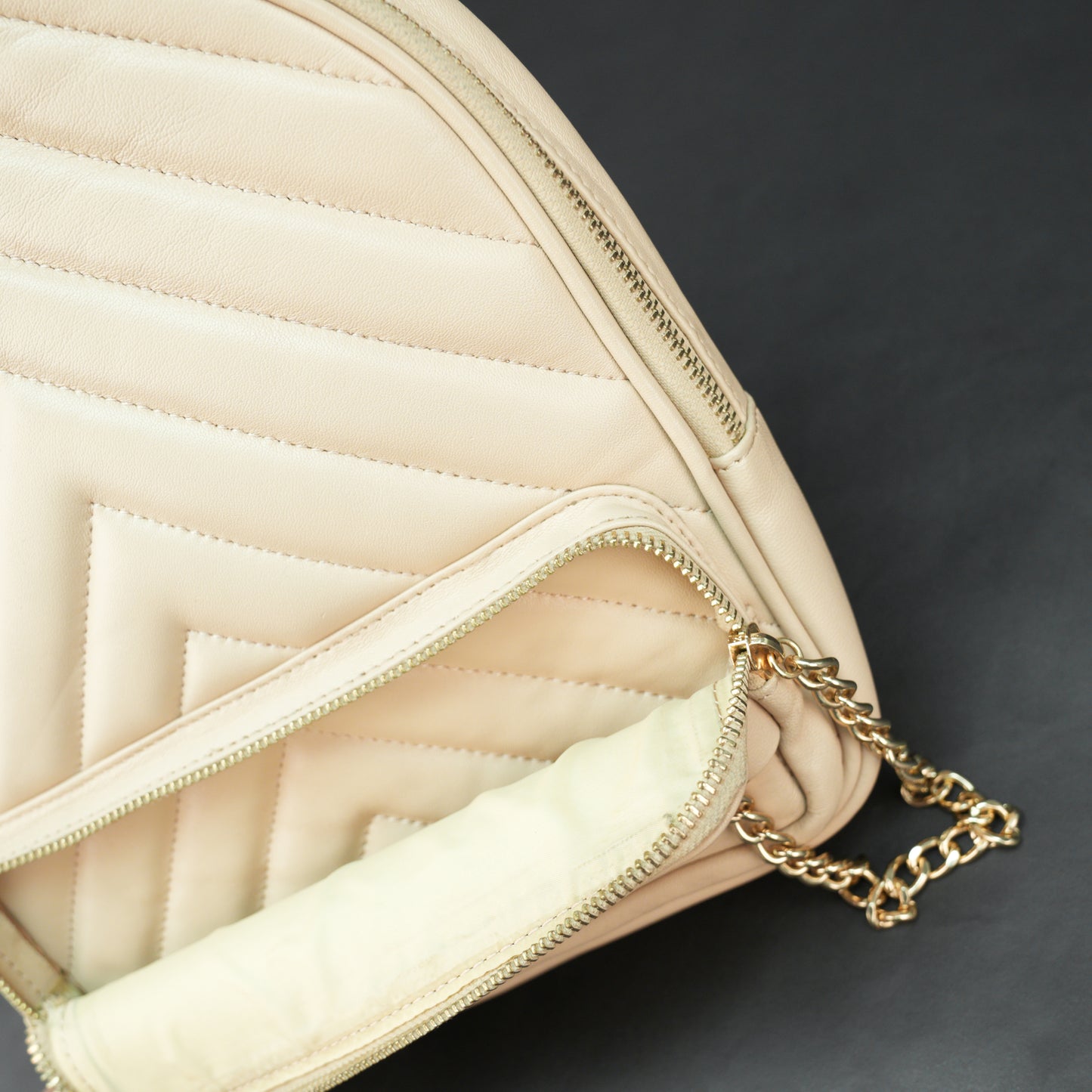 Backpack with adjustable straps, zipper pockets, and spacious main compartment.
