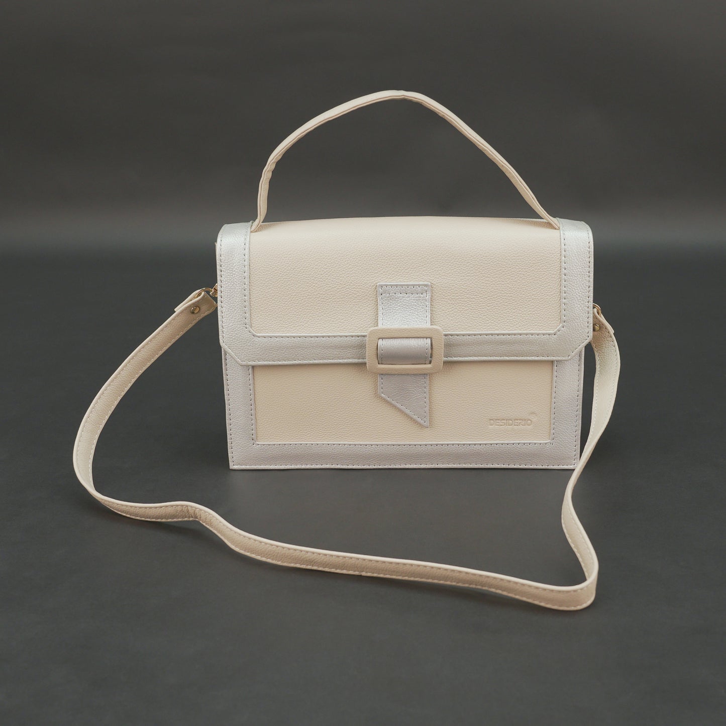 Beige leather crossbody handbag with zipper compartment.