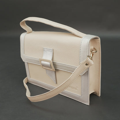Beige leather crossbody handbag with zipper compartment.