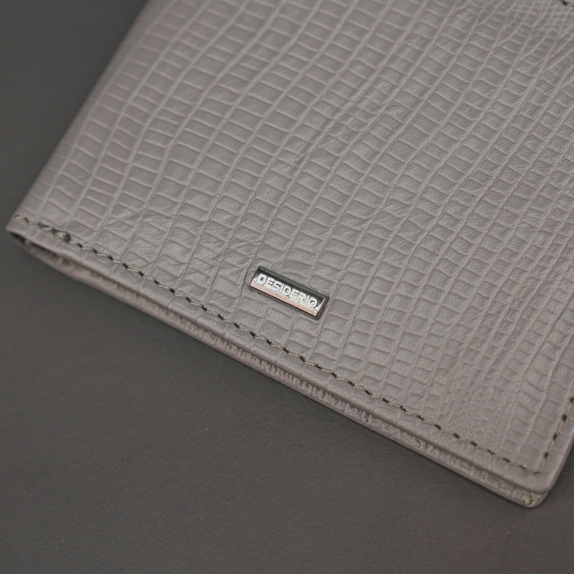 Premium grey leather wallet, sleek and compact holds 6 cards, 1 ID, and 2 cash compartments for everyday use.