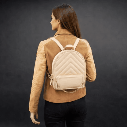 Backpack with adjustable straps, zipper pockets, and spacious main compartment.