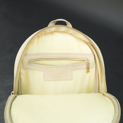 Backpack with adjustable straps, zipper pockets, and spacious main compartment.