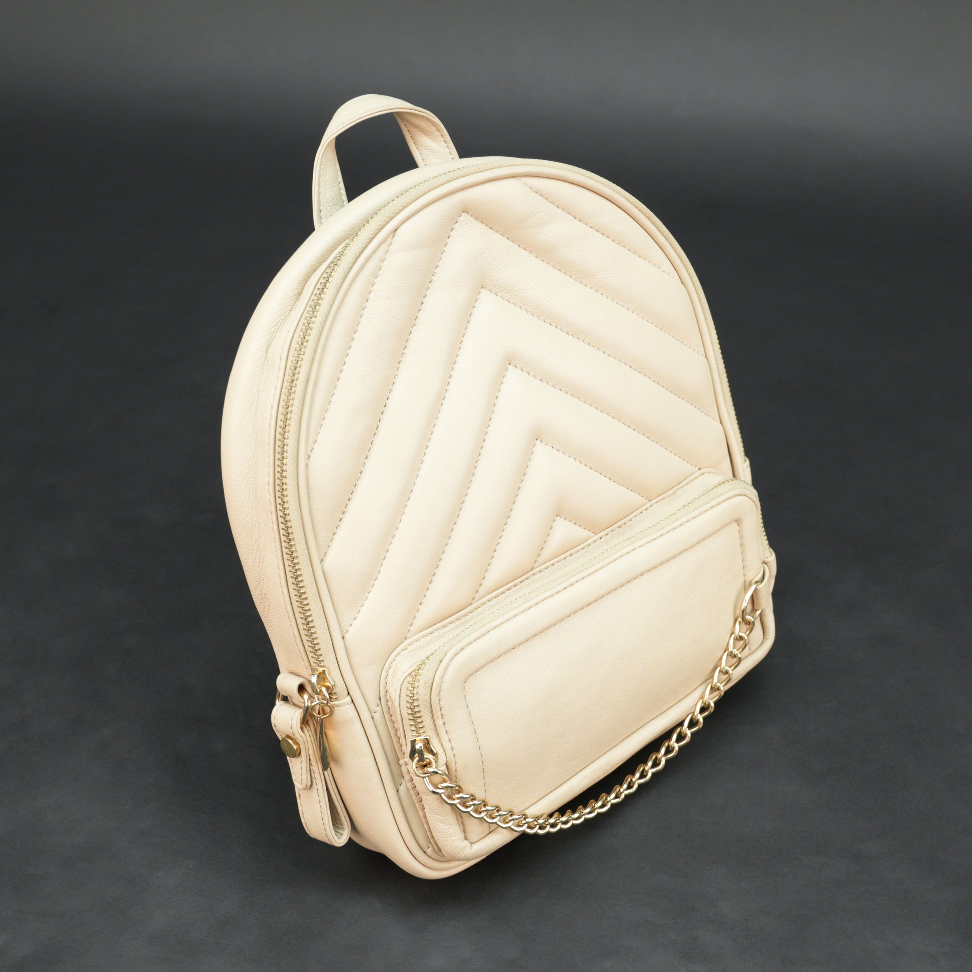 Backpack with adjustable straps, zipper pockets, and spacious main compartment.