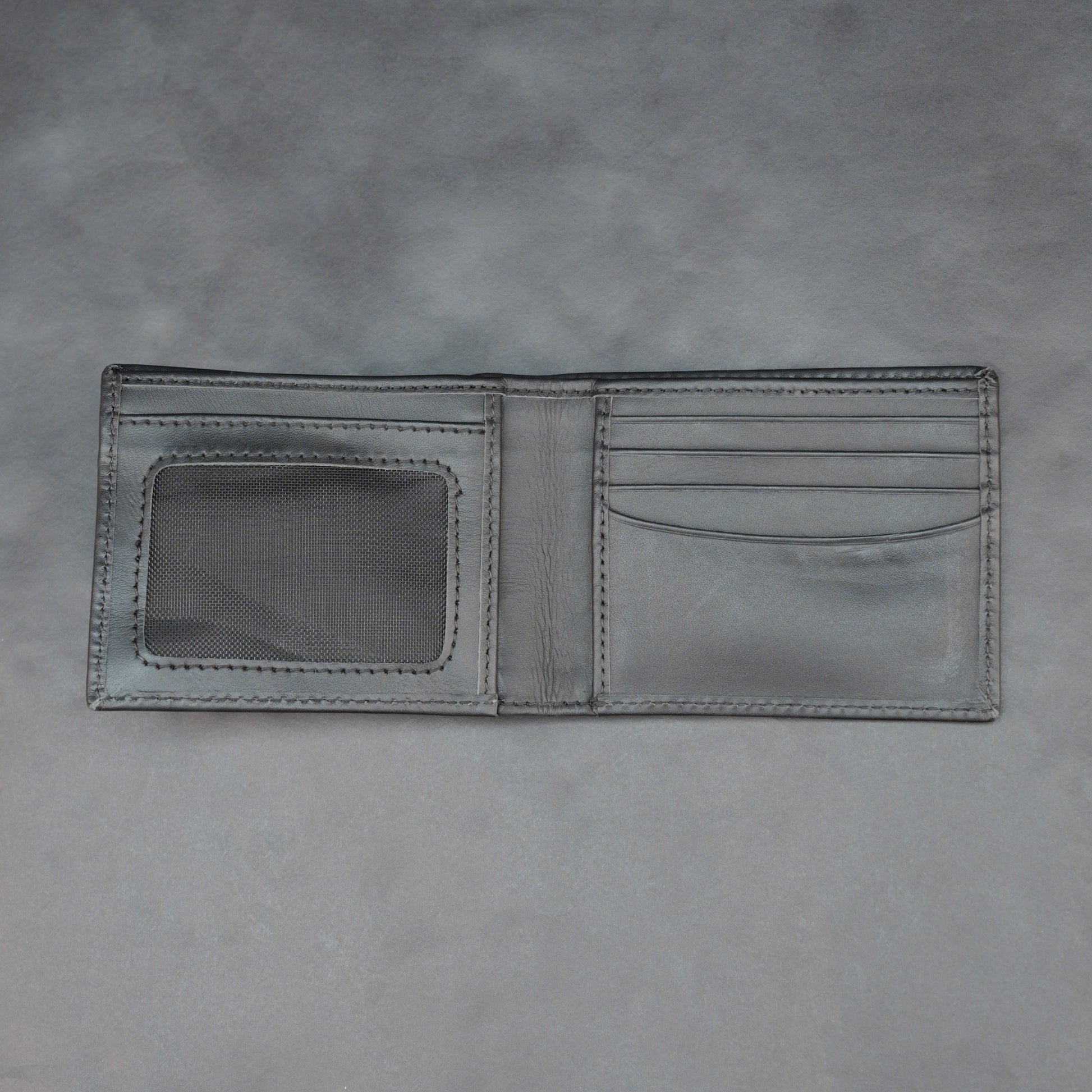 Black leather wallet with 10 card slots and 2 cash compartments, sleek, slim, and durable for everyday use
