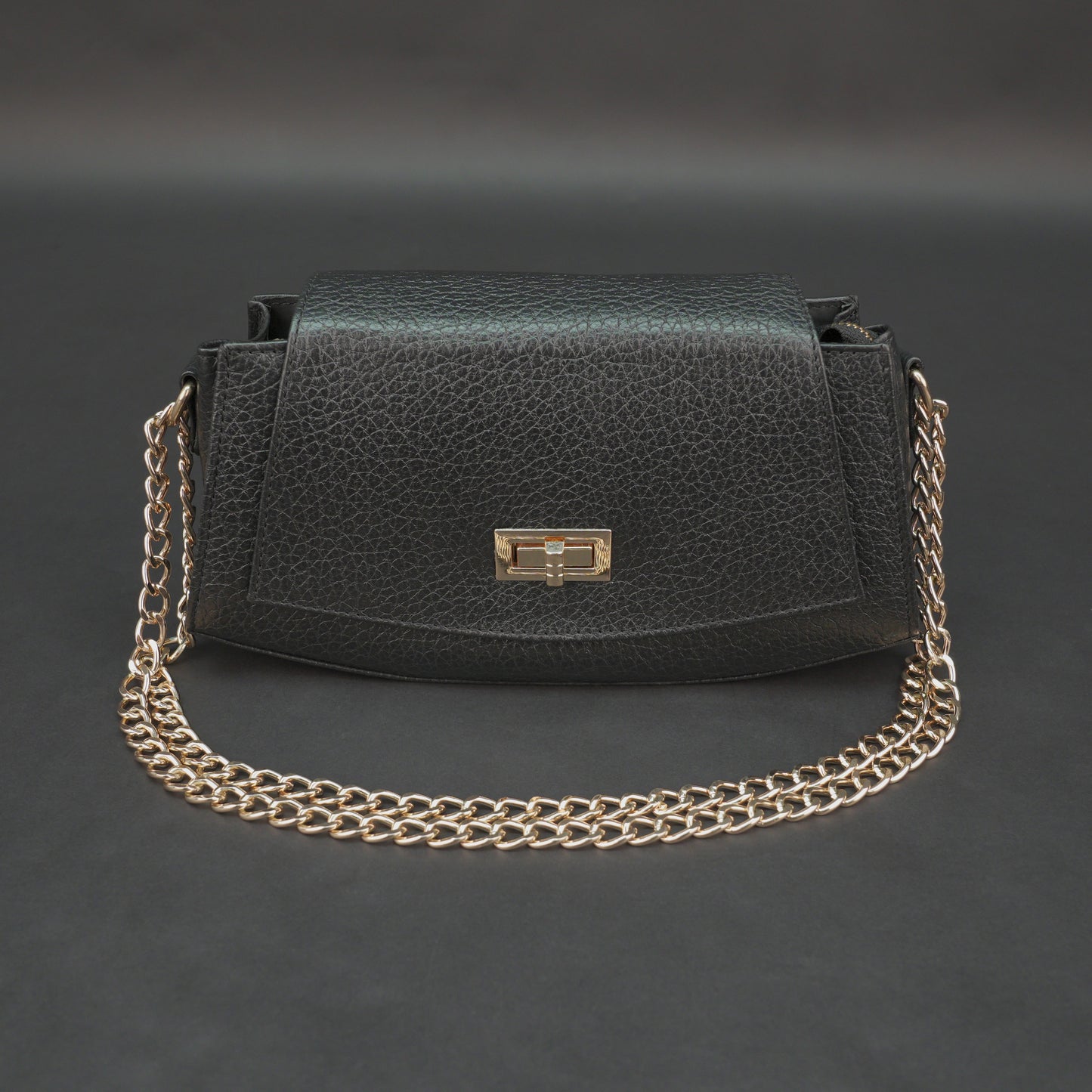 Real leather black handbag with brass chain, zipper compartment, shoulder strap, stylish and practical daily use bag