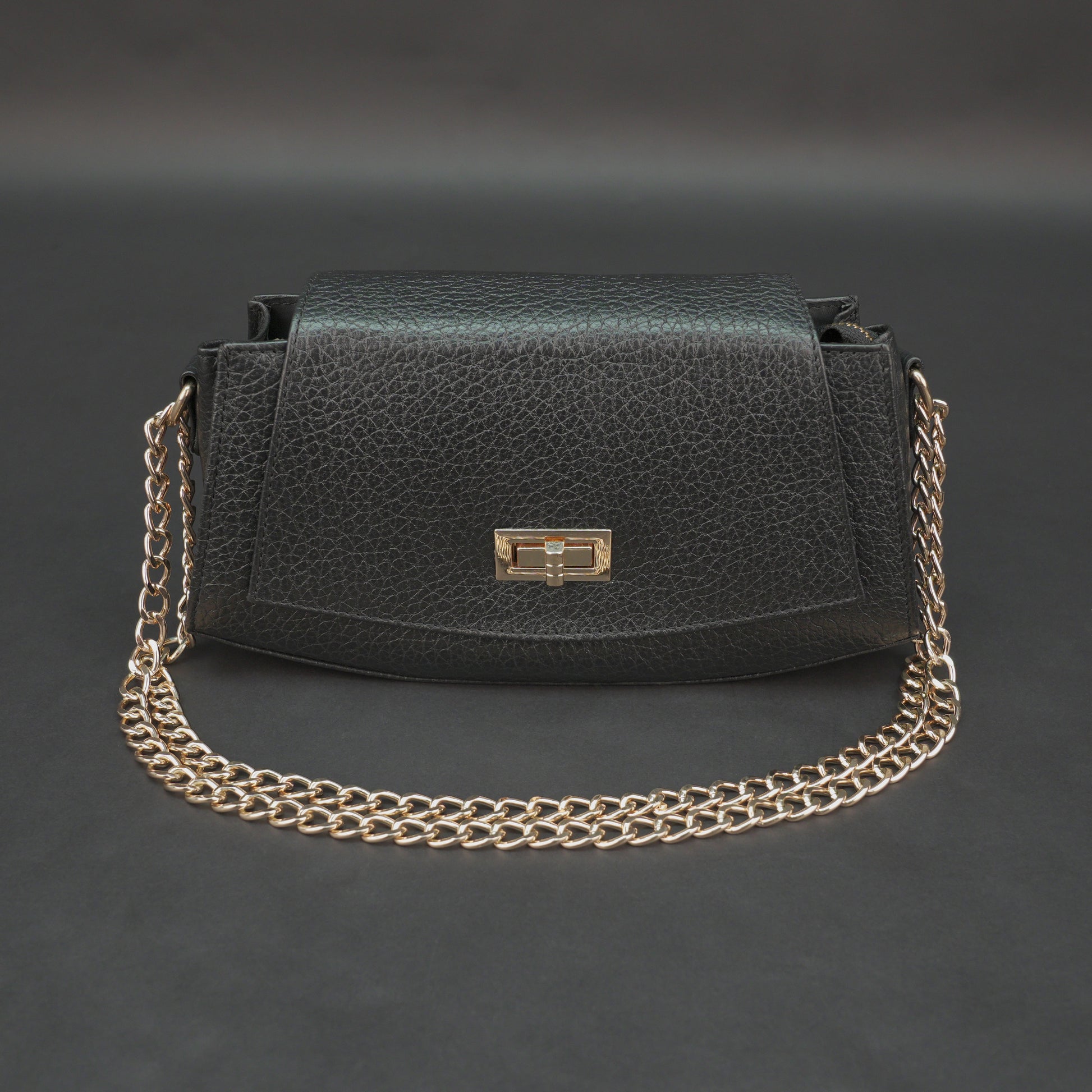 Real leather black handbag with brass chain, zipper compartment, shoulder strap, stylish and practical daily use bag