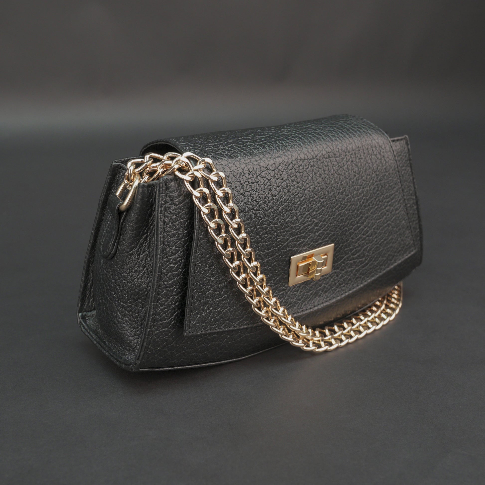 Real leather black handbag with brass chain, zipper compartment, shoulder strap, stylish and practical daily use bag