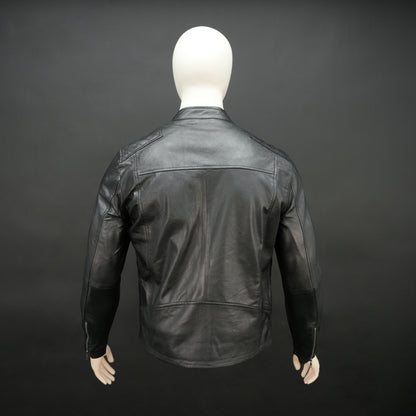 Black jacket with front zip closure, snap-button collar, zippered cuffs, multiple pockets including two side pockets, one vertical front pocket, and one inner pocket, offering a stylish and functional everyday design