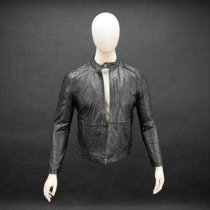 Black jacket with front zip closure, snap-button collar, zippered cuffs, multiple pockets including two side pockets, one vertical front pocket, and one inner pocket, offering a stylish and functional everyday design