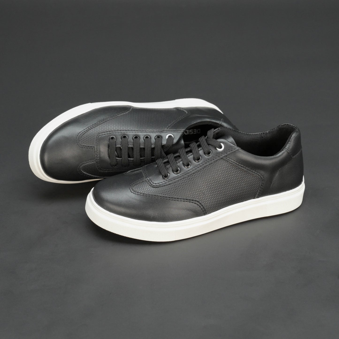 Black cow printed leather sneakers with mesh lining and TPR sole for comfort and durability