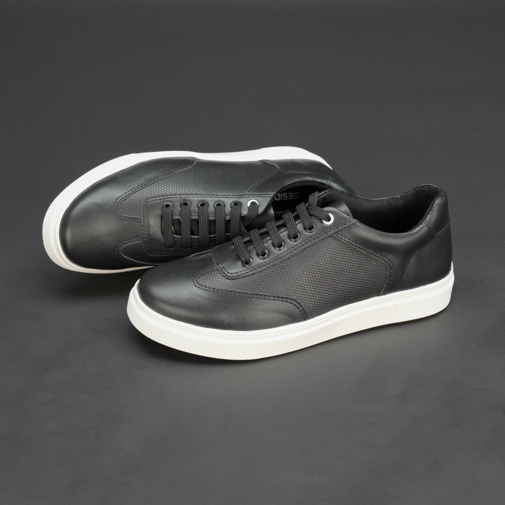 Black cow printed leather sneakers with mesh lining and TPR sole for comfort and durability