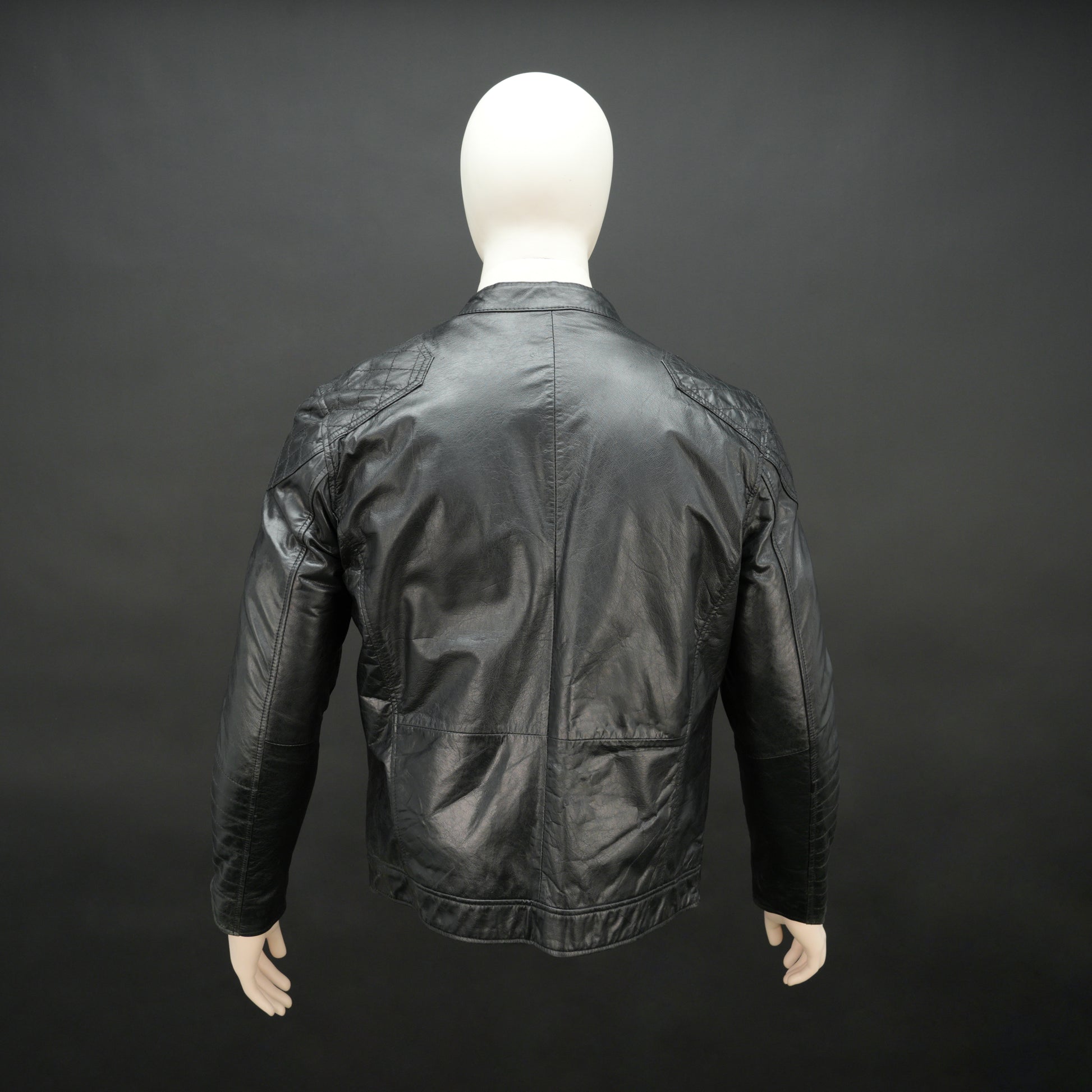 Men’s black jacket with front zip closure, two side pockets, one upper right front pocket, zip cuffs, snap-button collar, and an inside zipper pocket, combining style and functionality