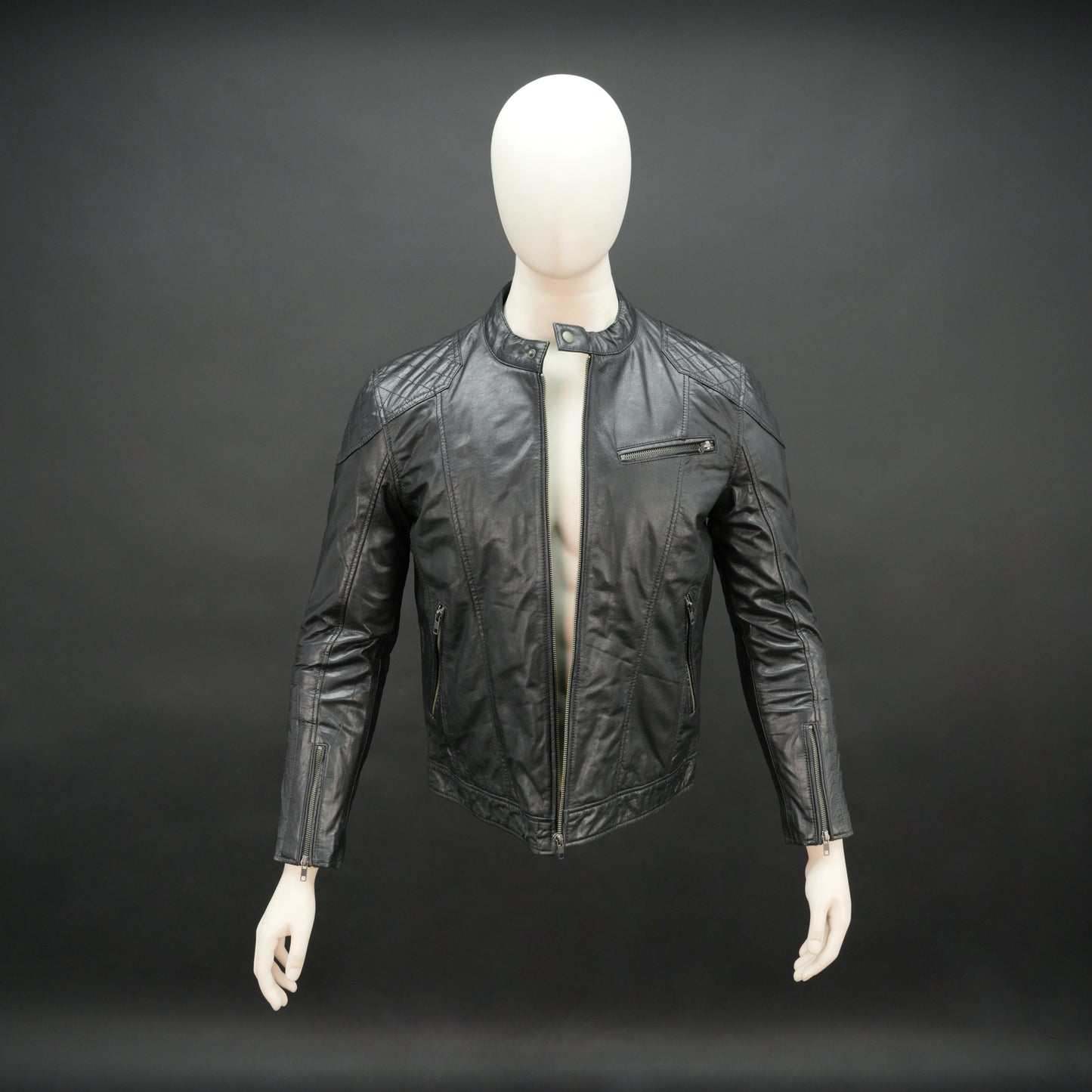 Men’s black jacket with front zip closure, two side pockets, one upper right front pocket, zip cuffs, snap-button collar, and an inside zipper pocket, combining style and functionality