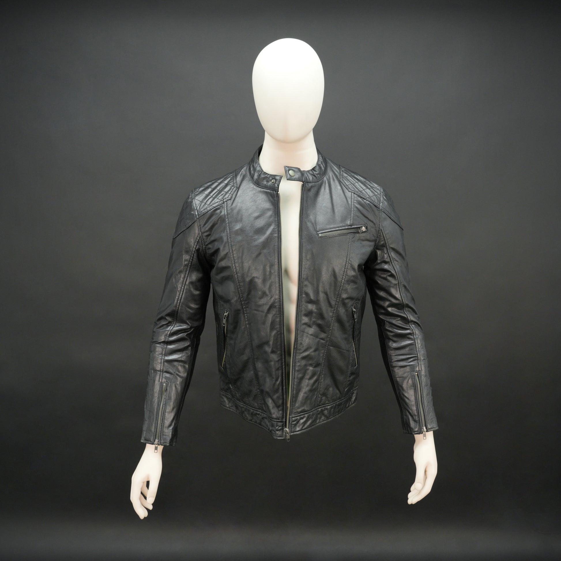 Men’s black jacket with front zip closure, two side pockets, one upper right front pocket, zip cuffs, snap-button collar, and an inside zipper pocket, combining style and functionality