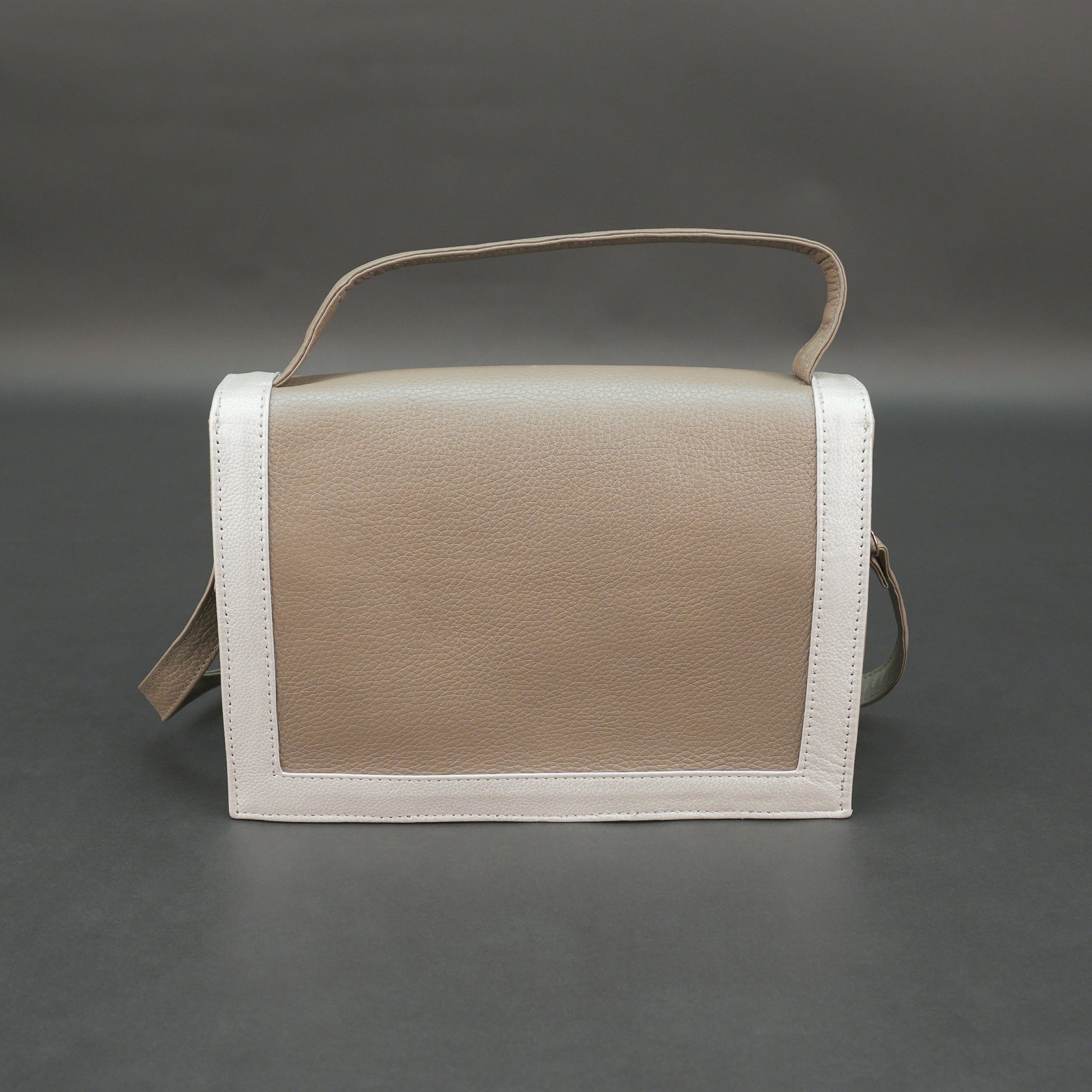 Camel leather crossbody handbag with zipper compartment.