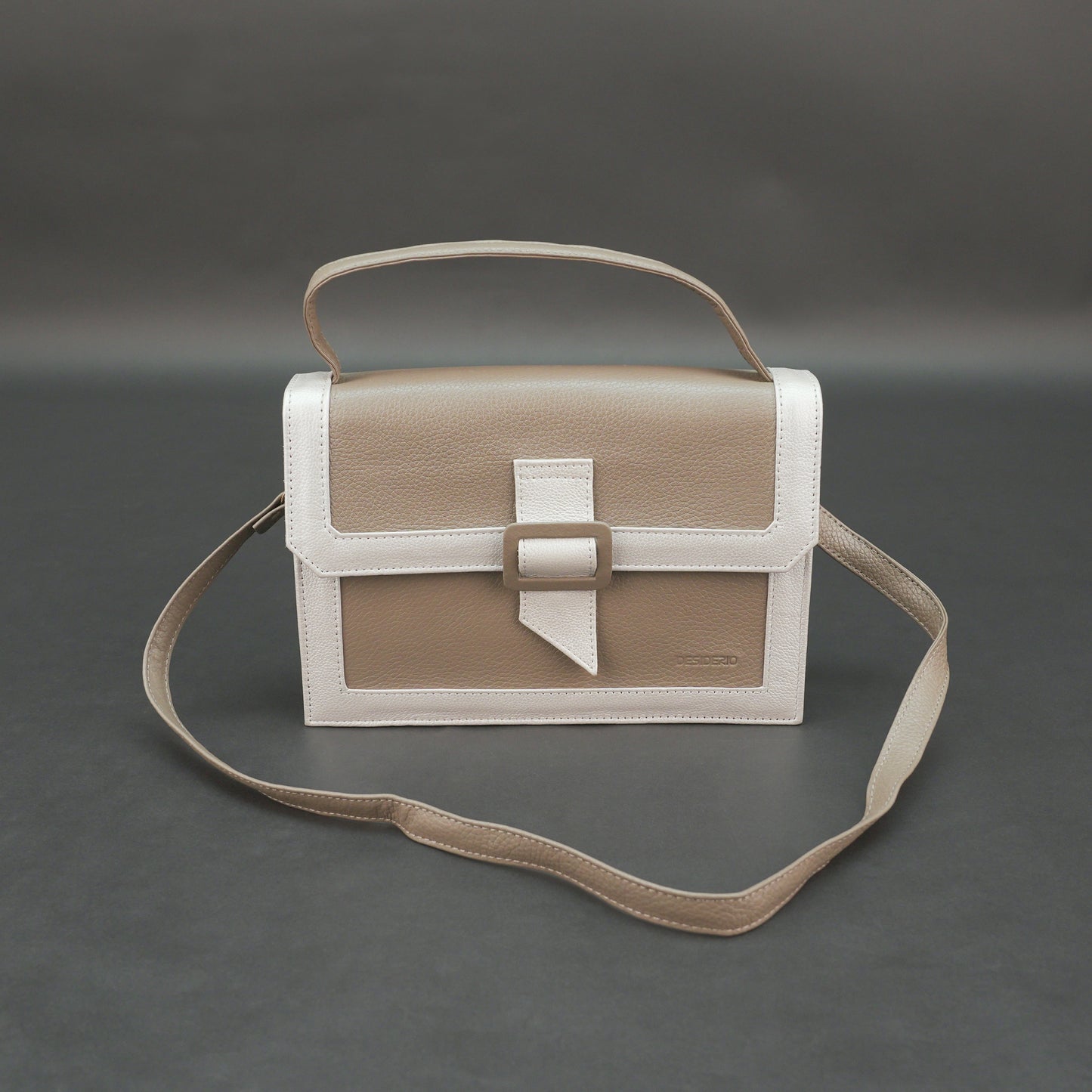 Camel leather crossbody handbag with zipper compartment.