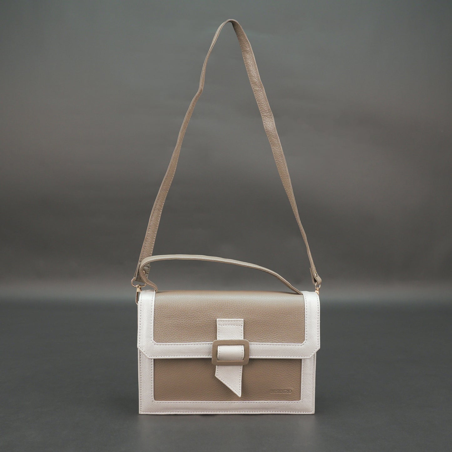 Camel leather crossbody handbag with zipper compartment.