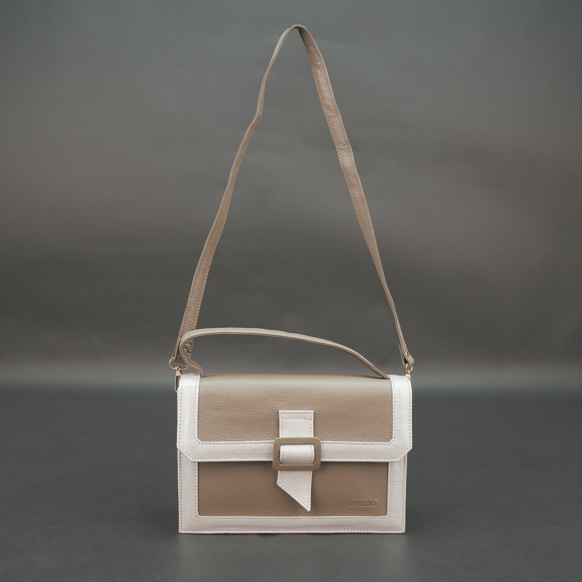 Camel leather crossbody handbag with zipper compartment.