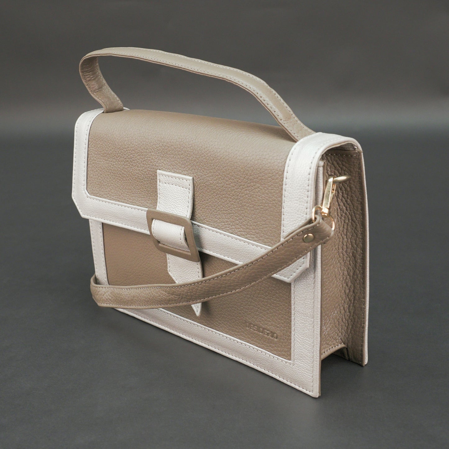 Camel leather crossbody handbag with zipper compartment.