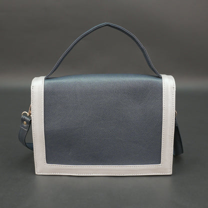 Dark blue leather crossbody handbag with zipper compartment and pocket.