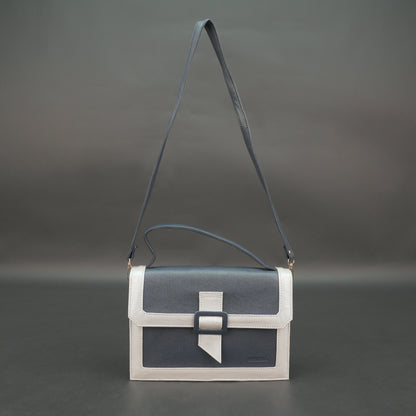 Dark blue leather crossbody handbag with zipper compartment and pocket.