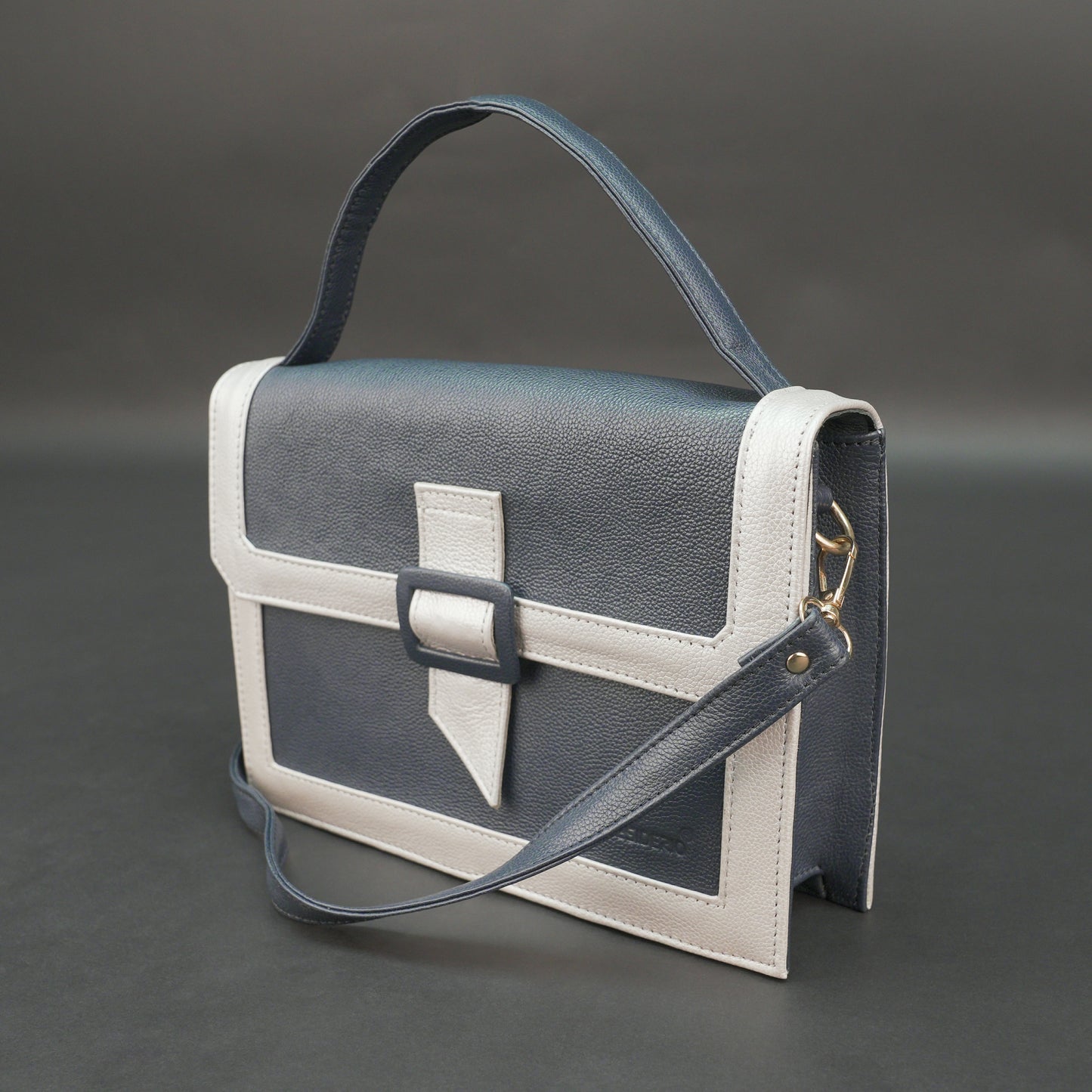 Dark blue leather crossbody handbag with zipper compartment and pocket.