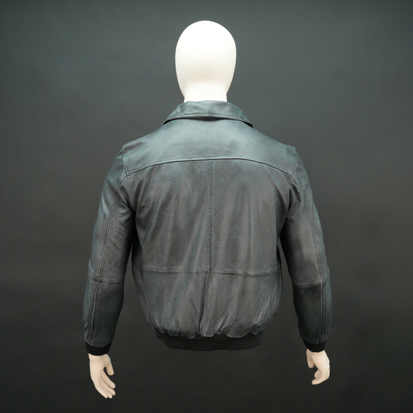 Men’s black leather jacket with zip closure, two side pockets, one left arm pocket, and one inside pocket, combining style and everyday functionality
